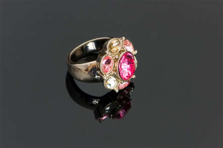 Golden ring on the highly reflective backgroundの写真素材