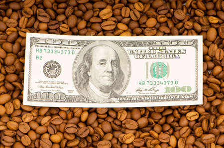 Close up of coffee beans and  dollarsの写真素材