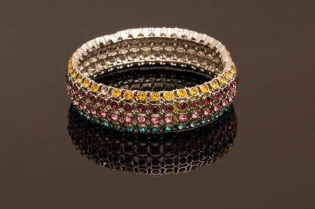 Hand bracelet on the highly reflective backgroundの写真素材