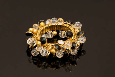 Hand bracelet on the highly reflective backgroundの写真素材