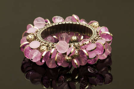 Hand bracelet on the highly reflective backgroundの写真素材