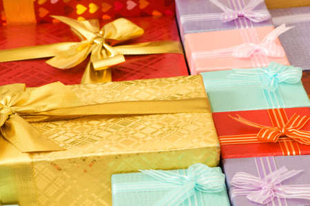 Close up of gift boxes with golden ribbonsの写真素材