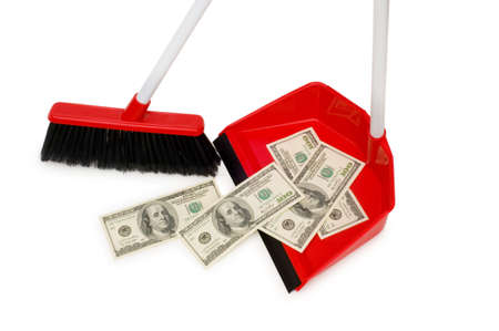 Brush sweeping dollars isolated on the whiteの写真素材