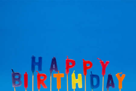Multi coloured candles with "Birthday" - plenty of copyspaceの写真素材