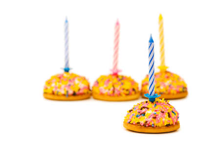 Cup cakes and candle isolated on the white backgroundの写真素材