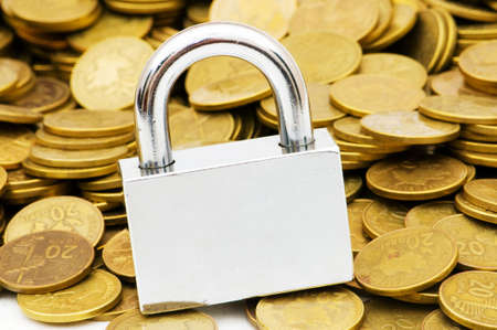 Concept of financial security with lock and coinsの写真素材
