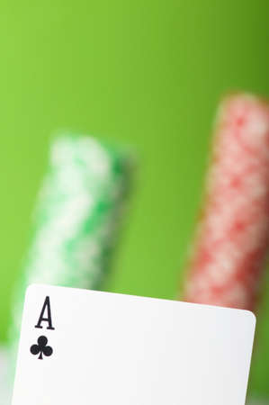 Casino chips and four aces against green backgroundの写真素材