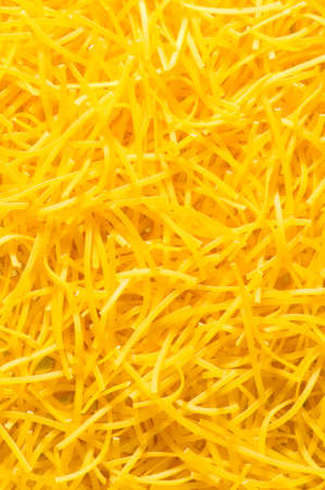 Extreme close up of yellow italian pastaの写真素材