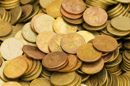 Pile of golden  coins isolated on whiteの写真素材