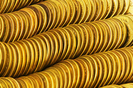Pile of golden  coins isolated on white