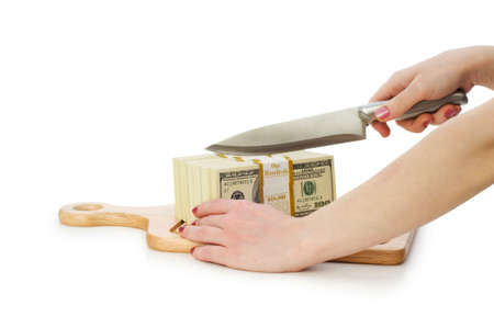 Money concept - cutting dollars with the knifeの写真素材