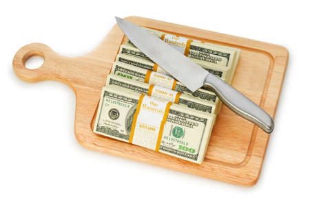 Money concept - cutting dollars with the knifeの写真素材