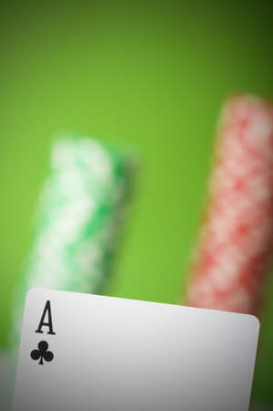 Casino chips and four aces against green backgroundの写真素材