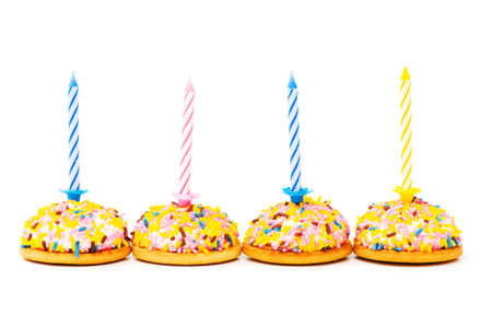 Cup cakes and candle isolated on the white backgroundの写真素材