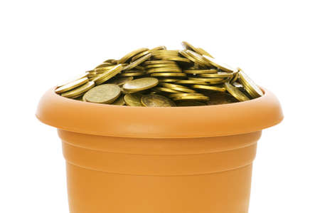 Many coins in the clay pot on whiteの写真素材