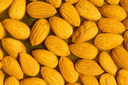 Fresh almonds arranged as a backgroundの写真素材