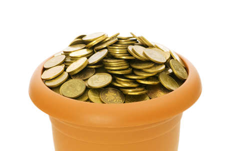 Many coins in the clay pot on whiteの写真素材