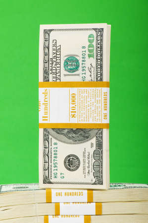 Stack of dollars isolated on the green