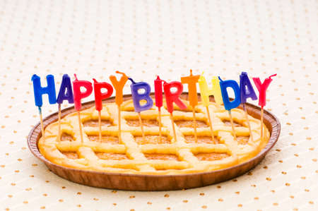 Happy birthday candles in the pieの写真素材