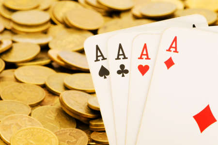 Four aces and lots of gold coinsの写真素材