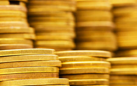 Close up of gold coin stacks - shallow DOF