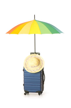 Travelling concept with case and umbrella on the whiteの写真素材