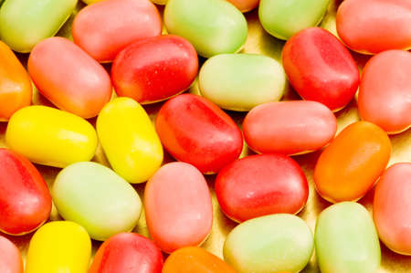 Various dry colourful sweets arranged as background