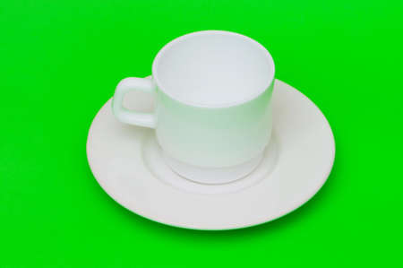 White cup isolated on the colourful backgroundの写真素材