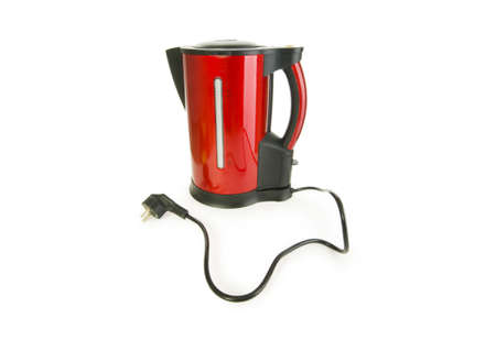 Red electrical kettle isolated on white