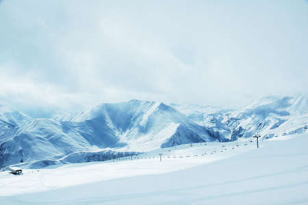 High mountains under snow in the winterの写真素材