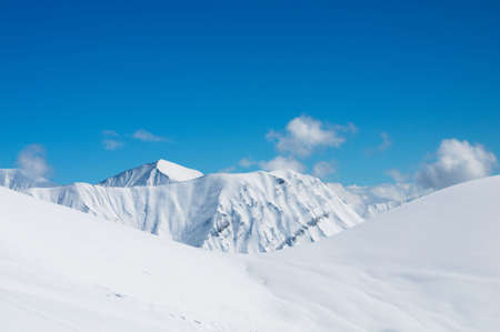 High mountains under snow in the winterの写真素材