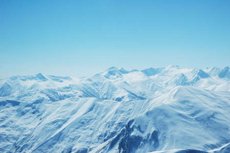 High mountains under snow in the winterの写真素材