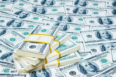 Stack of dollars on money background