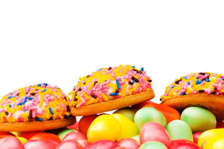 Sweet cakes and colourful gums at the background