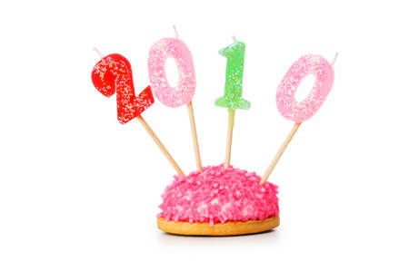 Candles with 2010 year against colourful backgroundの写真素材
