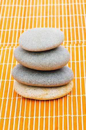 Stack of spa pebbles against blurred backgroundの写真素材