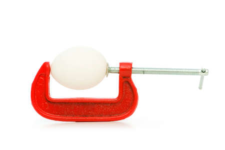 Strength concept with egg and clamp on whiteの写真素材