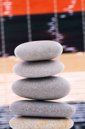 Stack of spa pebbles against blurred background