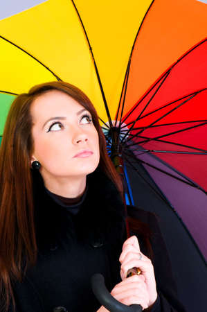 Portrait of young woman with umbrellaの写真素材