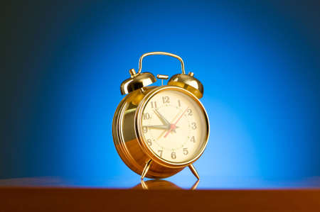 Alarm clock against colourful background