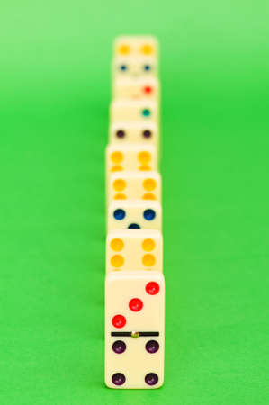 Lots of dominoes on the green backgroundの写真素材