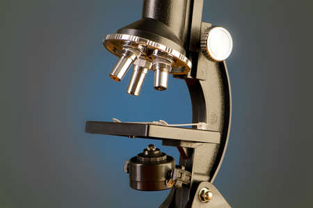 Microscope against blue gradient backgroundの写真素材