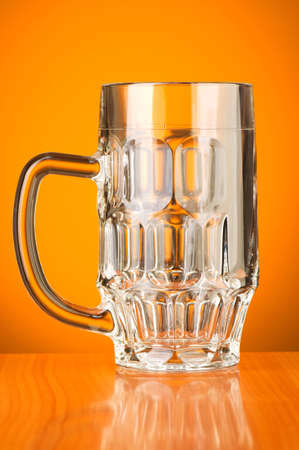 Beer glass against gradient backgroundの写真素材