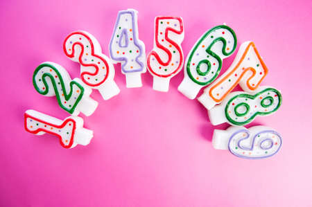 Birthday candles against colourful background