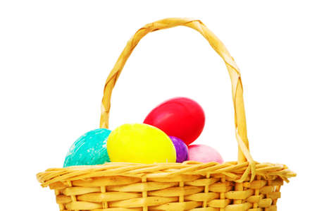 Easter concept with eggs and basket on white