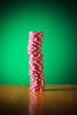 Stack of casino chips against gradient backgroundの写真素材