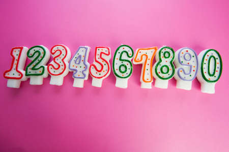 Birthday candles against colourful background