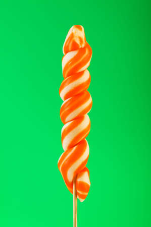 Colourful lollipop against the colourful backgroundの写真素材