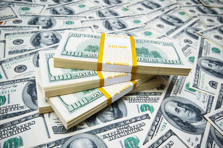 Stack of dollars on money background
