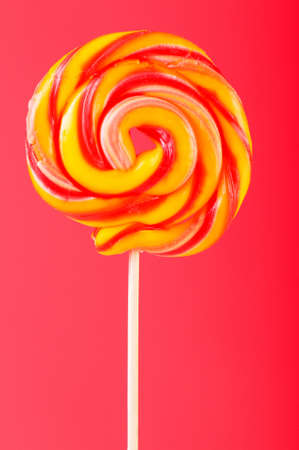 Colourful lollipop against the colourful backgroundの写真素材